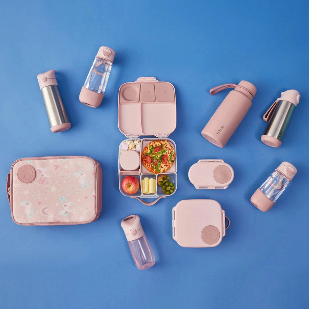B.box Insulated Flexi Lunchbag in pastel pink, open to show divided compartments and matching bottles.