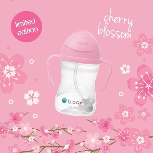 B.Box New Sippy Cup Gelato Edition in pink with clear body and handles, limited cherry blossom design.