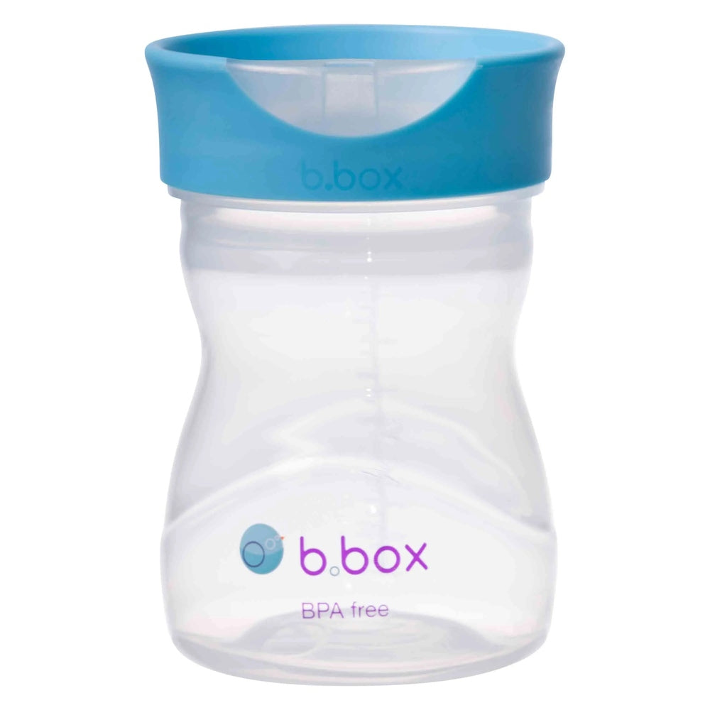 B.BOX Training Cup with blue lid; clear BPA-free bottle featuring a curved, toddler-friendly grip.