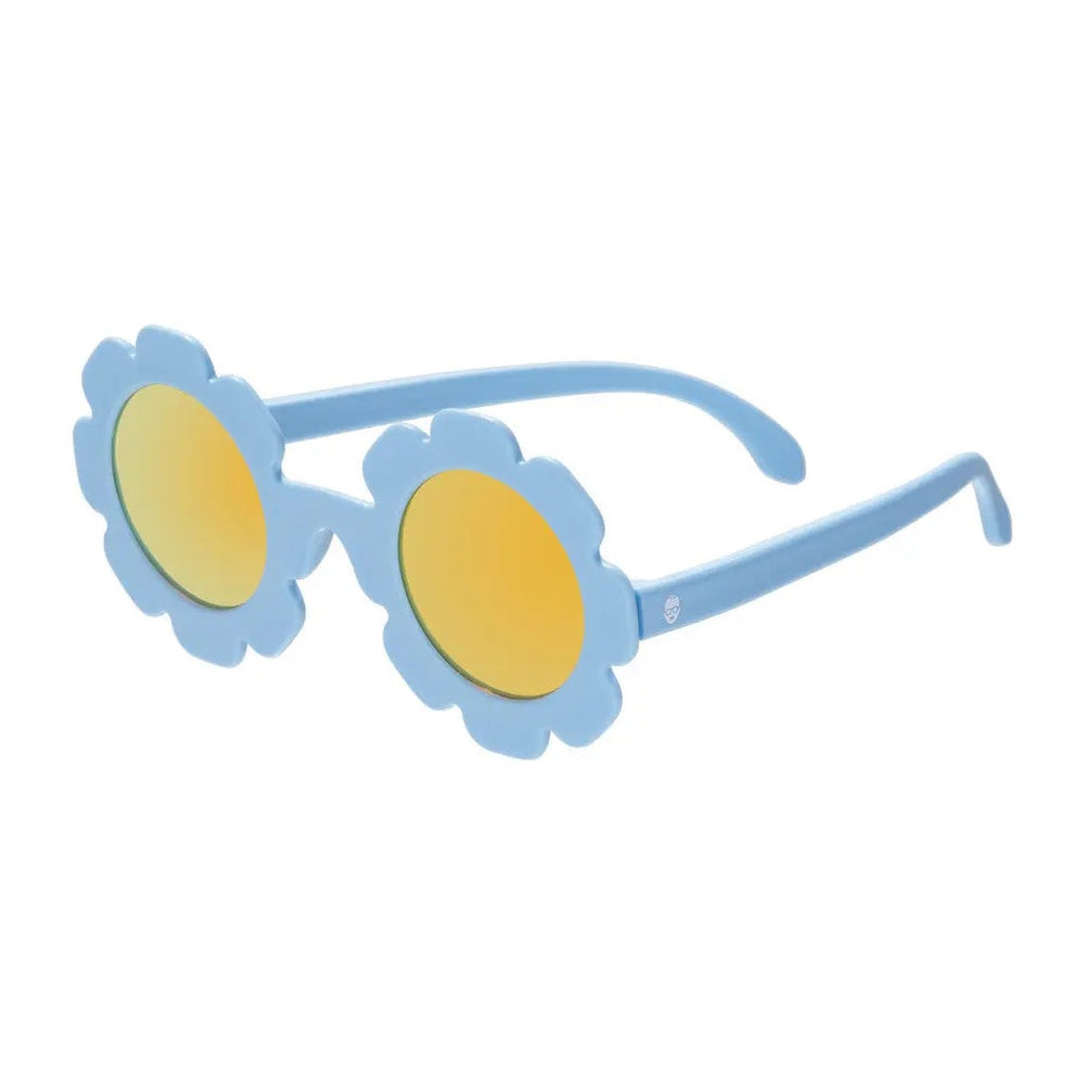 Babiators The Wild Flower blue flower-shaped sunglasses with yellow mirrored lenses, shown laid flat to showcase playful frames.