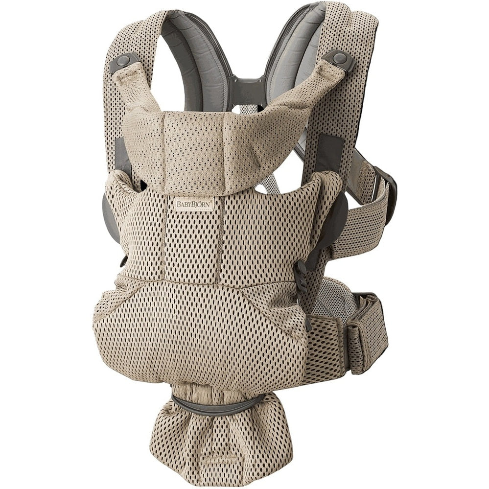 BabyBjorn Baby Carrier Free in beige mesh worn on an adult, showing padded shoulders and supportive waist belt.