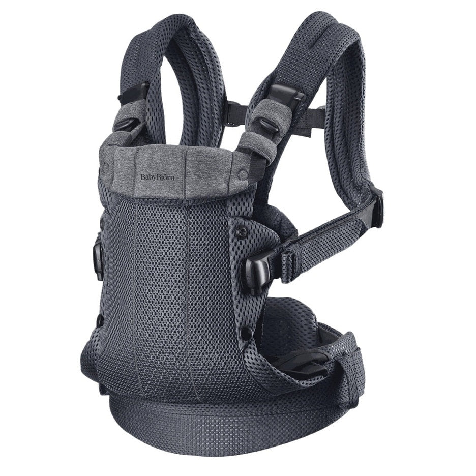 BabyBjorn Baby Carrier Harmony in gray mesh worn on a parent with padded straps and buckles.