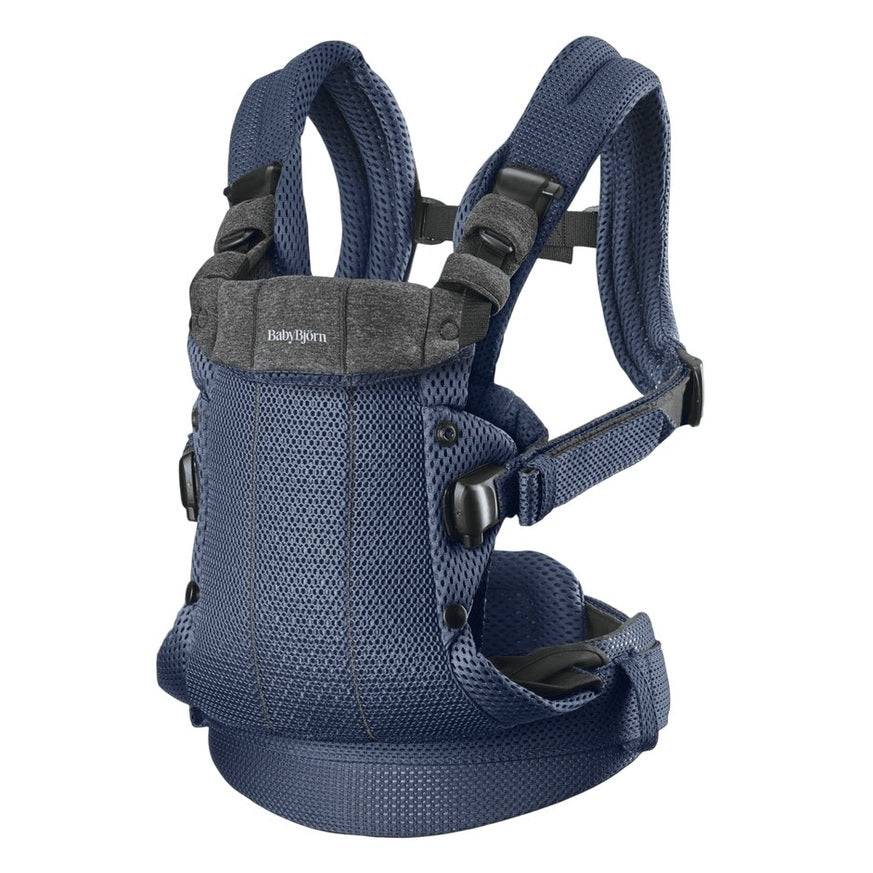 BabyBjorn Harmony baby carrier in navy blue mesh with padded straps and waist belt for comfortable front carry.