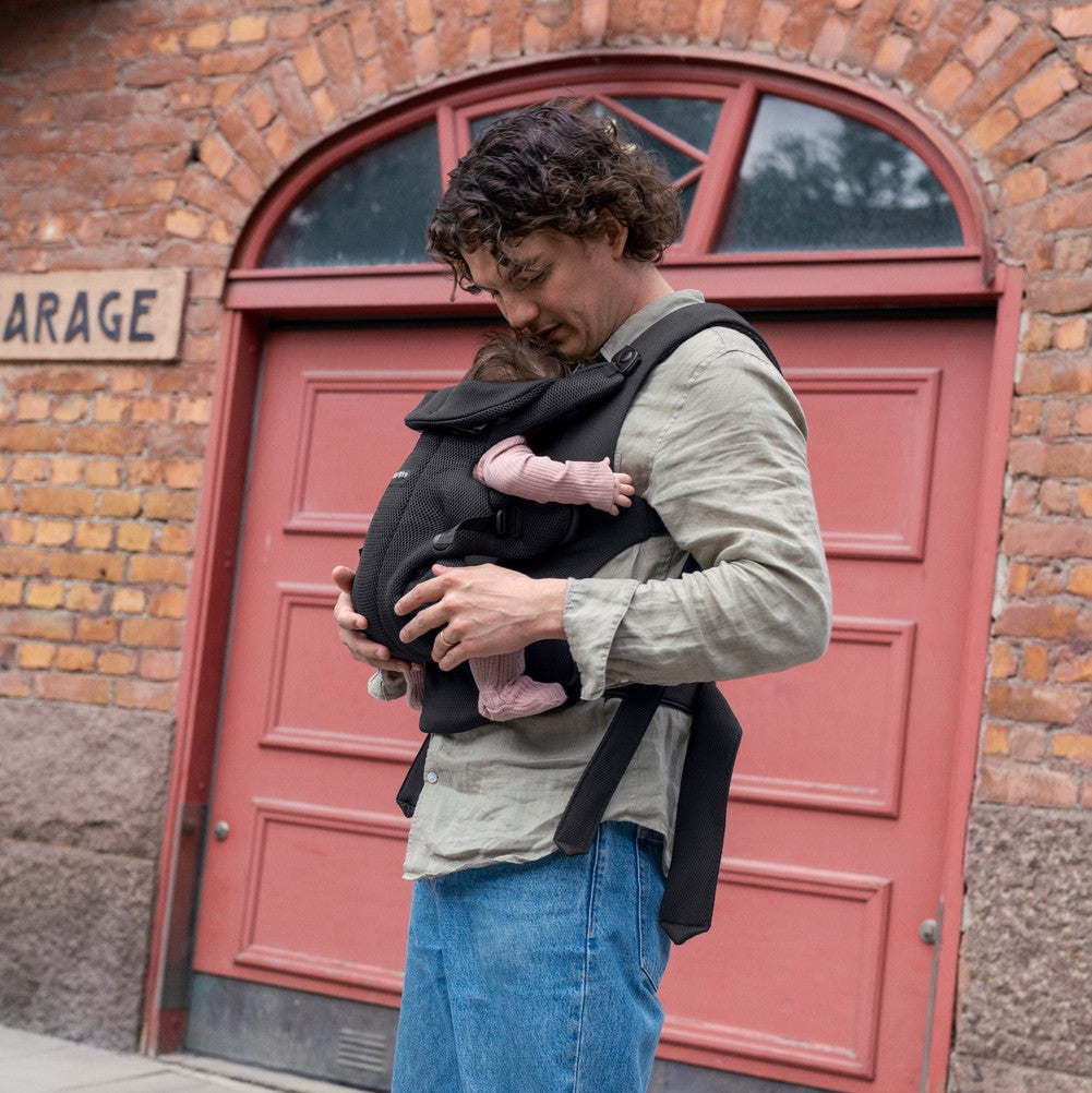 BabyBjörn Baby Carrier Hold in 3D Mesh Black - parent carrying baby inward outdoors