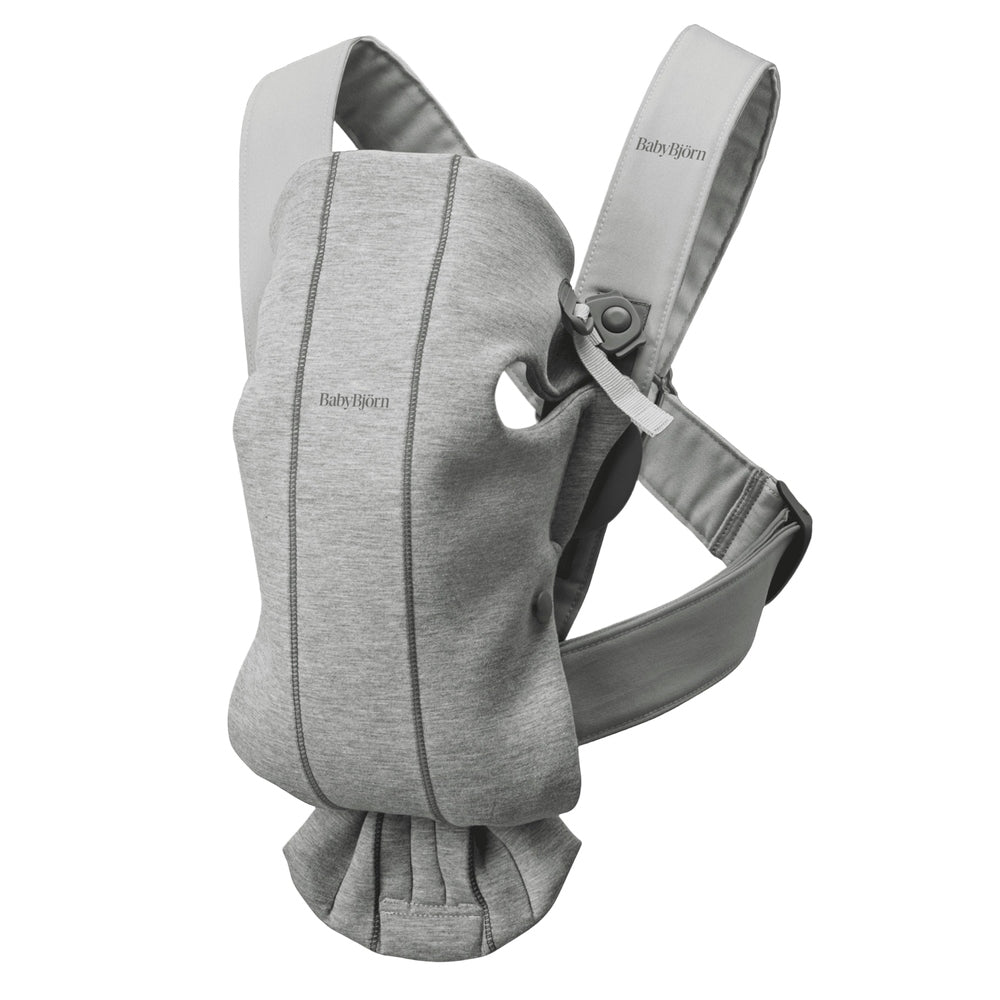 BabyBjorn Baby Carrier Mini in gray, ergonomic front carrier with padded shoulder straps and waist belt.