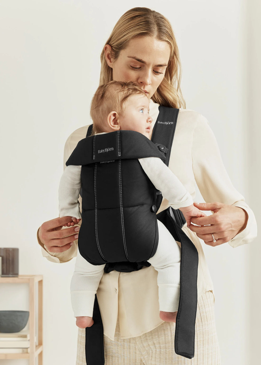 BabyBjörn Baby Carrier Mini — official lifestyle view (Woven, Black)