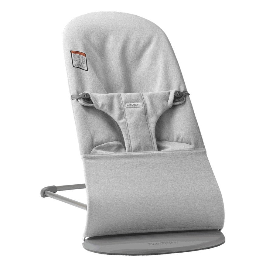 BabyBjorn Bouncer Bliss in light gray fabric with safety harness and curved rocking base.
