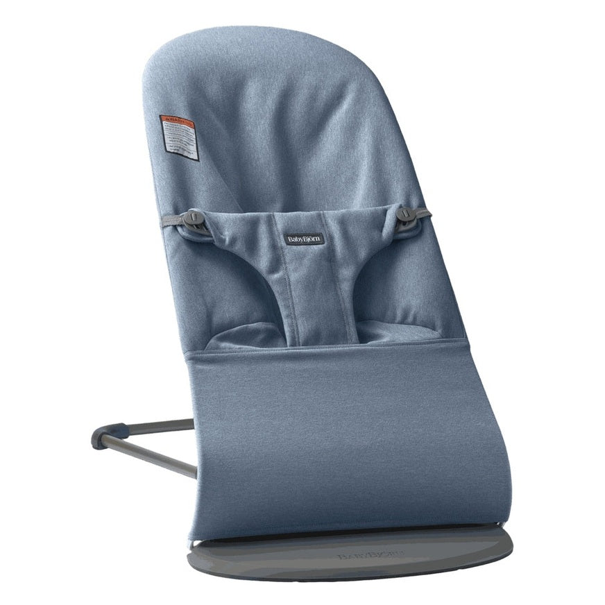 BabyBjorn Bouncer Bliss blue fabric infant bouncer secured to a sturdy gray frame with safety harness.