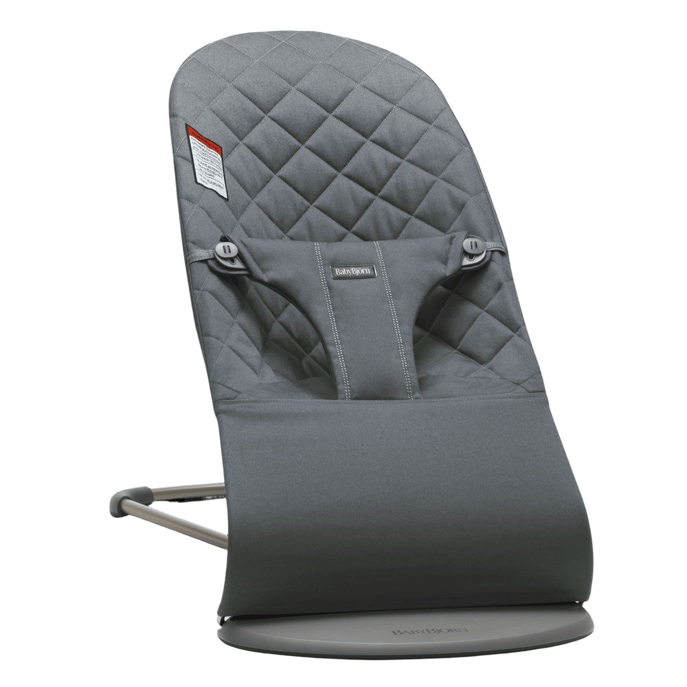 BabyBjorn Bouncer Bliss in gray with quilted back, supportive seat on a round base stand.