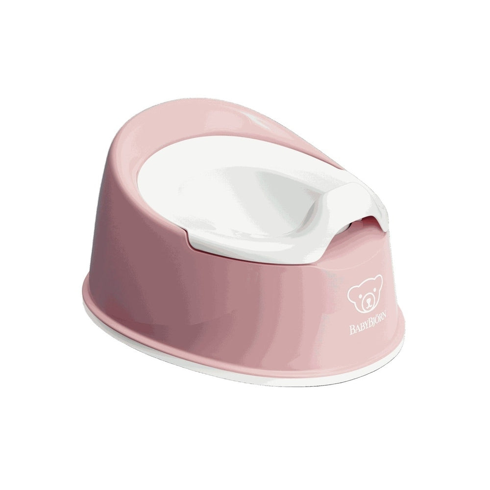 BabyBjorn Smart Potty in pink with white inner bowl, showcasing easy-clean curved seat.