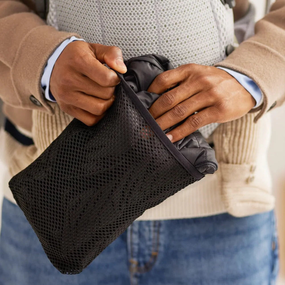BabyBjörn Winter Cover in Black packed into its inner pocket