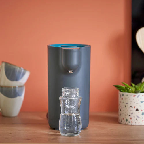 Babymoov Instant Baby Bottle Warmer Milky Now, compact gray warmer with a clear bottle