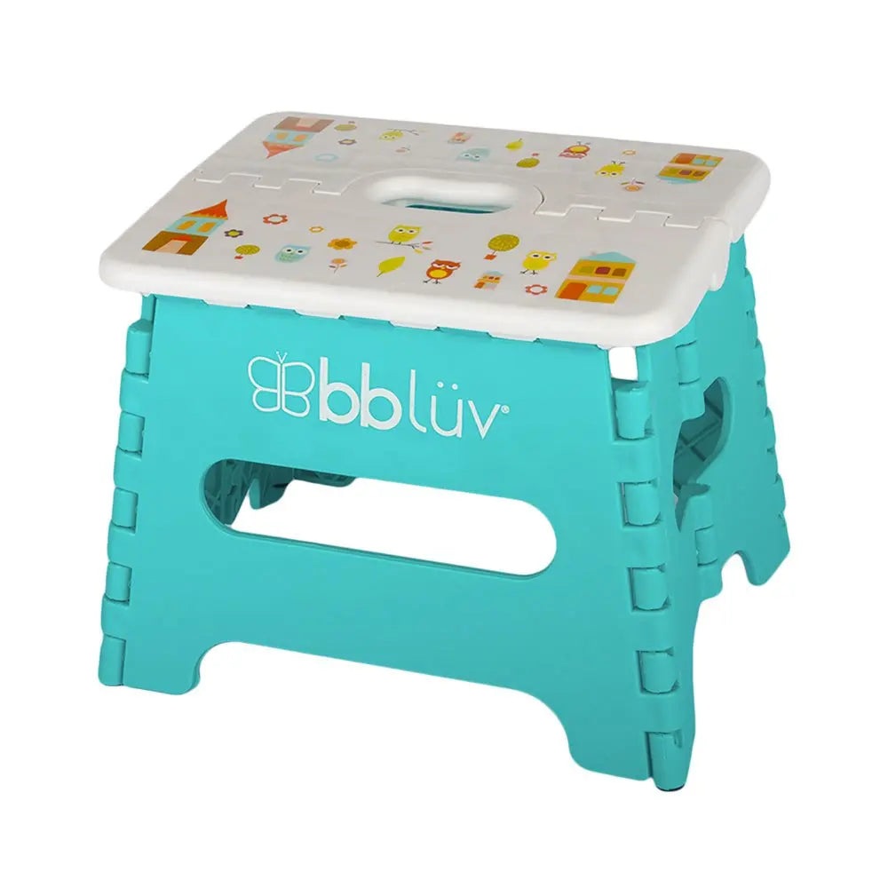 Bbluv Step Folding Step Stool in turquoise with a white patterned top showing a secure handle cutout and foldable hinged sides.