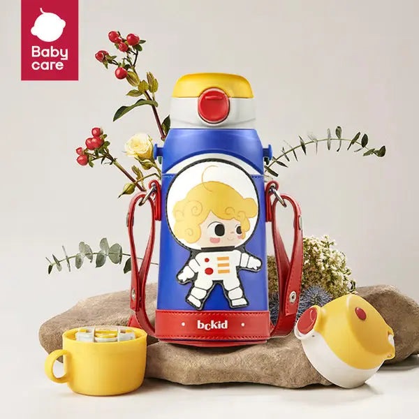Bc Babycare 3 In 1 Vacuum Bottle 600 ml, blue body with astronaut graphic, yellow lid, red accents, carried by red straps.