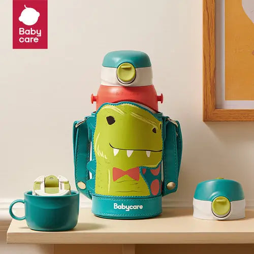 BC Babycare 3-in-1 Vacuum Bottle 600 ml in turquoise dinosaur print, with cup and lid beside it