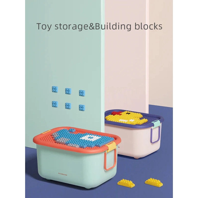 BC Babycare Building Blocks Storage Box two-piece set in pastel mint with orange and blue lids, with bricks.