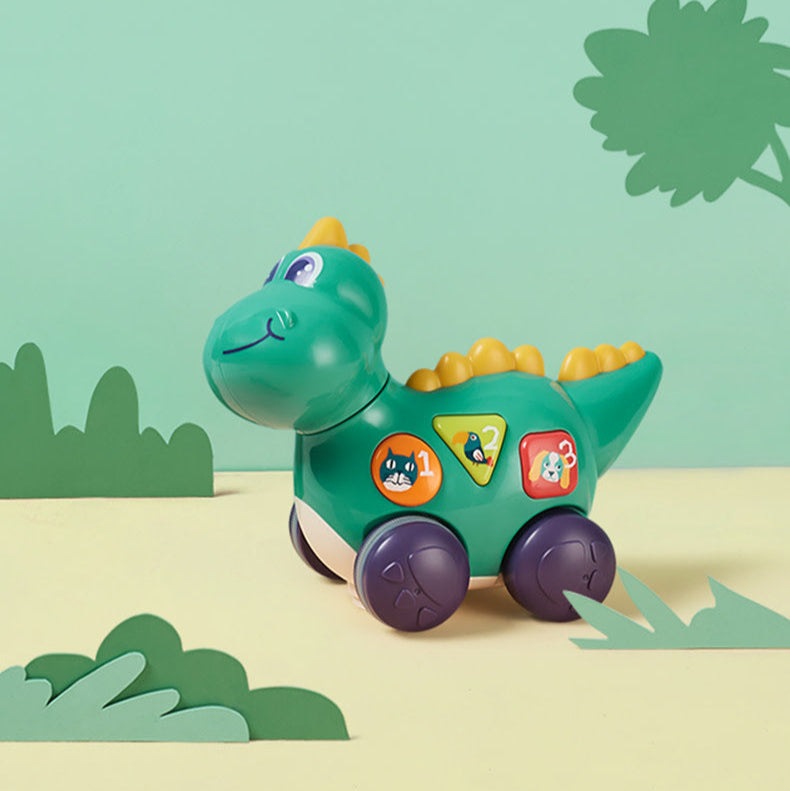 Bc Babycare Bump & Go dinosaur toy in green with purple wheels and colorful stickers