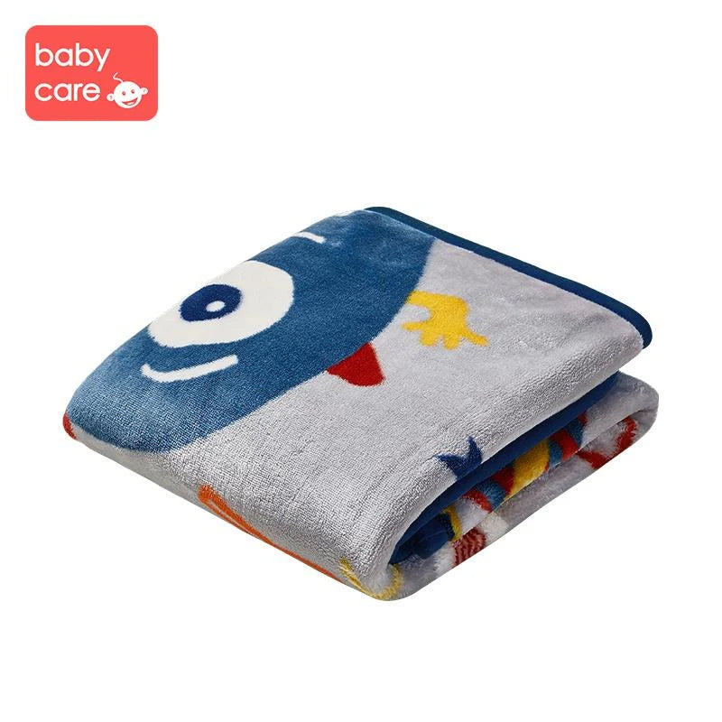 BC Babycare Cozy Blanket Dual Layer Beast folded, blue plush fabric with playful monster print