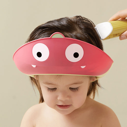 BC Babycare Dinosaur Shower Cape Red worn by toddler during bath time