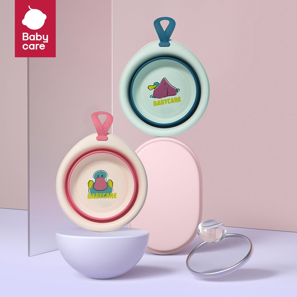 BC Babycare foldable baby washbasin set in pastel pink and teal with hanging straps