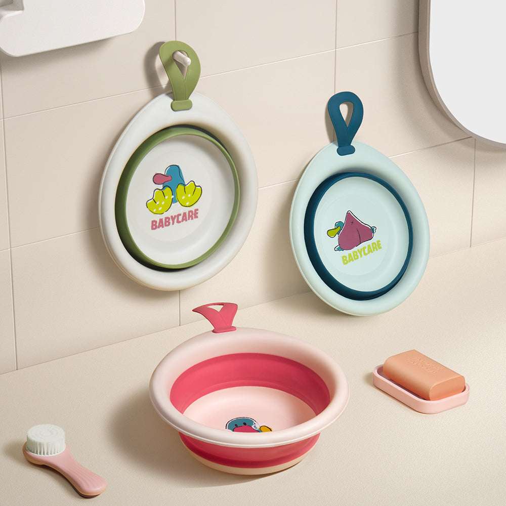 BC Babycare foldable baby washbasin in pink exterior and red interior, compact space-saving design