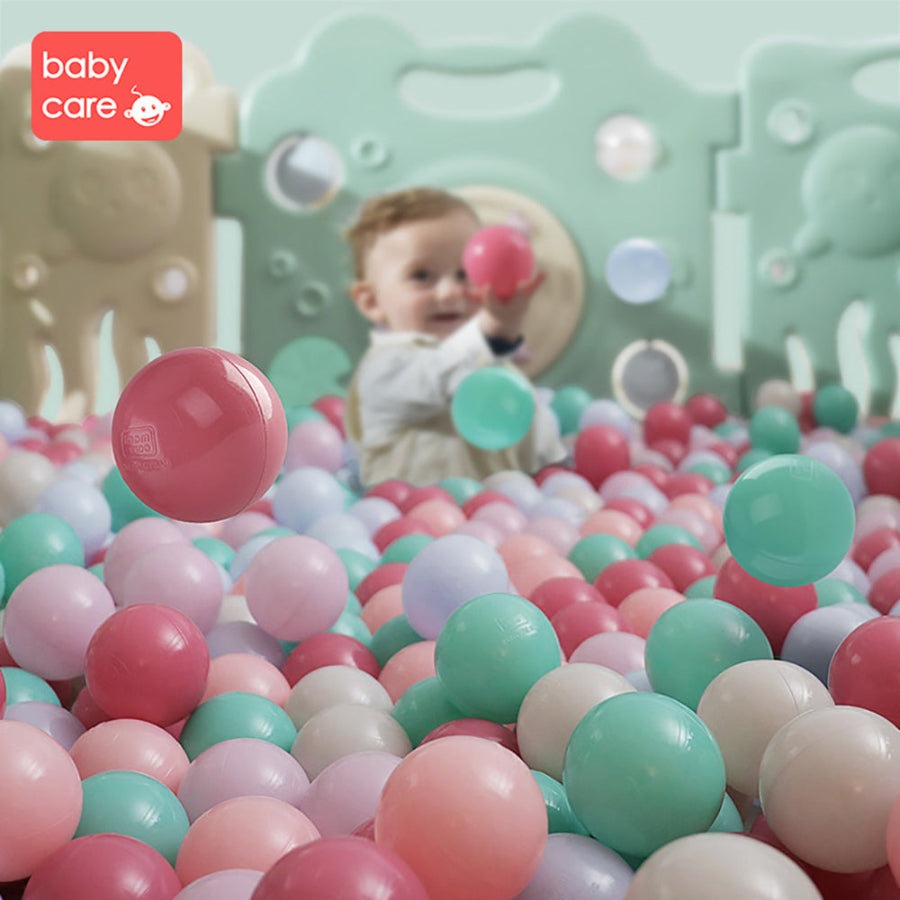 BC Babycare Kids Ocean Balls: colorful plastic ball pit balls with a toddler playing in the background.