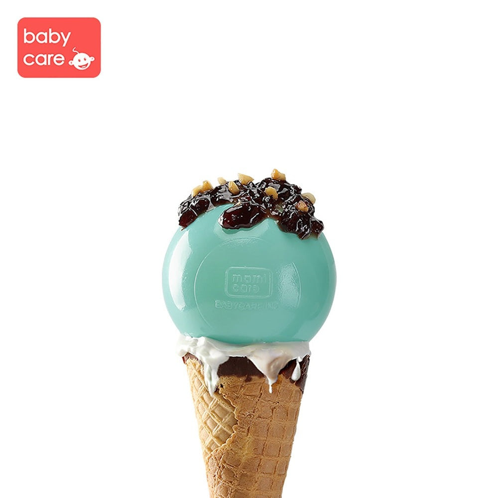 BC Babycare Kids Ocean Balls turquoise sphere atop a waffle cone with white icing and chocolate toppings
