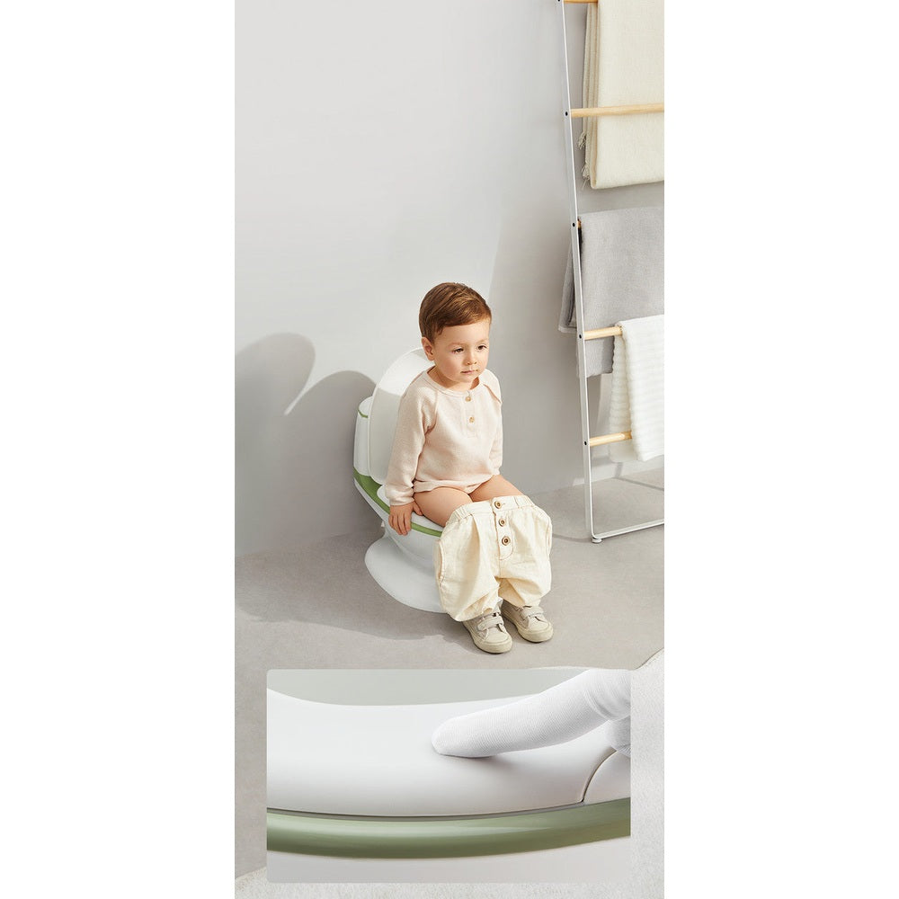BC Babycare Kids Training Toilet white and green seat; toddler in beige outfit for scale