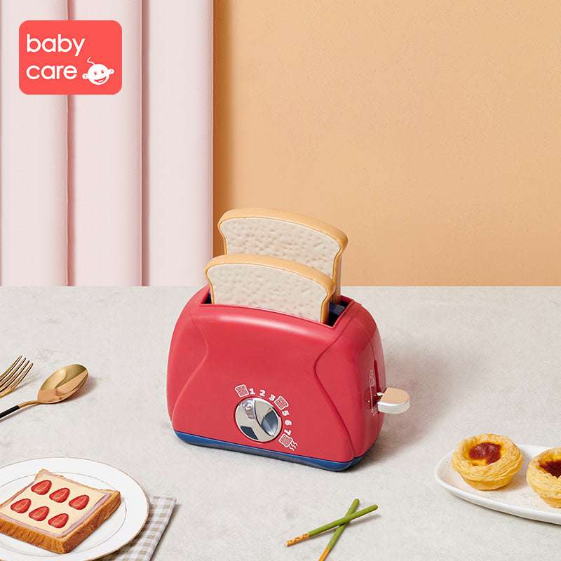 BC Babycare Little Cooker Toaster Toy in red with two beige toast slices