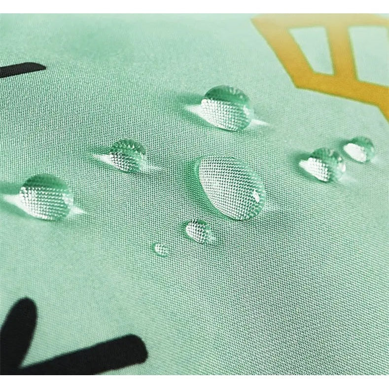 Bc Babycare Long Sleeve Bib in mint green fabric with water droplets beading on the sleeve.