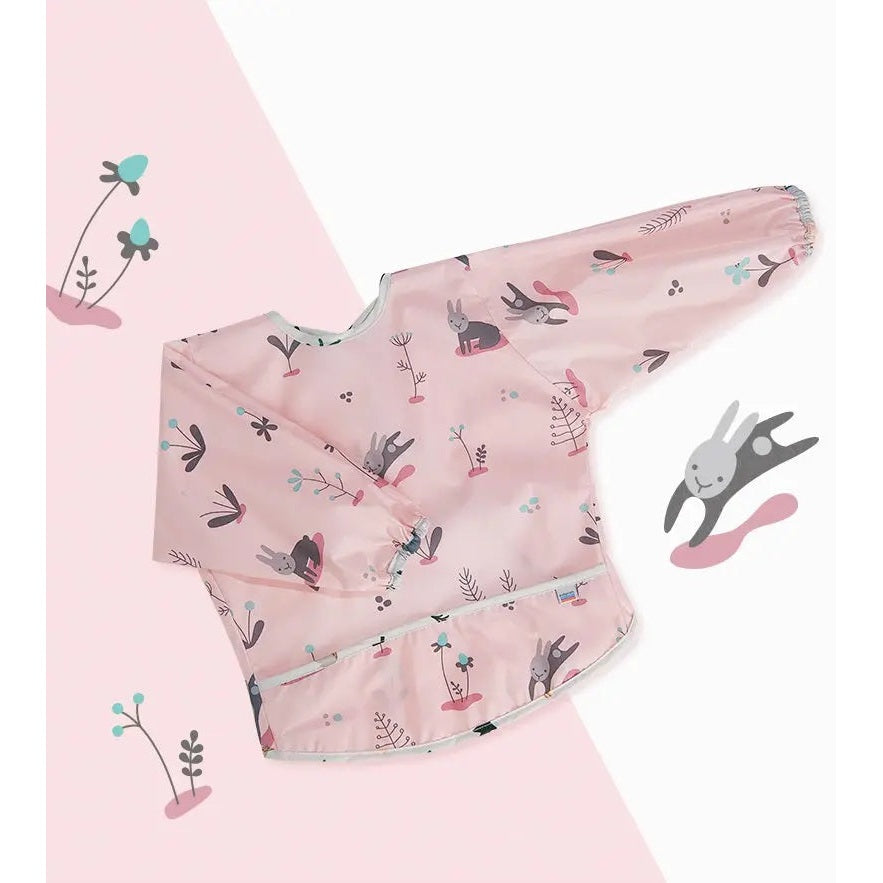 BC Babycare Long Sleeve Bib in pink with rabbit and plant print, laid flat to show full-coverage sleeves.