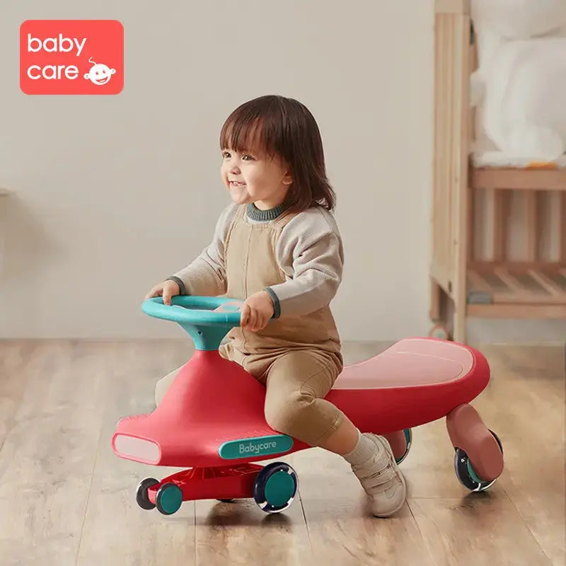 BC Babycare Nyokiroad Wiggle Car, red ride-on with turquoise steering handle, toddler riding and steering.