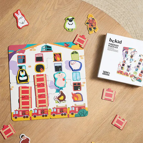 Bc Babycare Puzzle Game Set: colorful town scene puzzle with fire trucks and cheerful characters, pieces scattered near the box.
