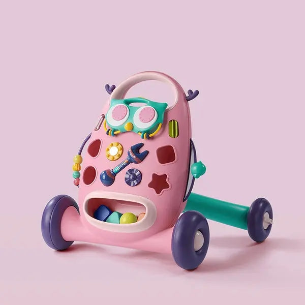 Bc Babycare Ride On Walker pink with colorful attached toys and purple wheels in a playful setup.