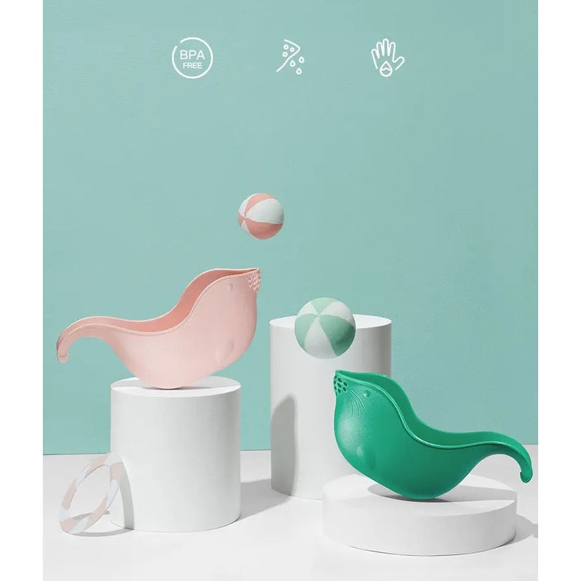 BC Babycare Shower Rinse Cup pair in pink and green balanced on white pedestals for bath time.