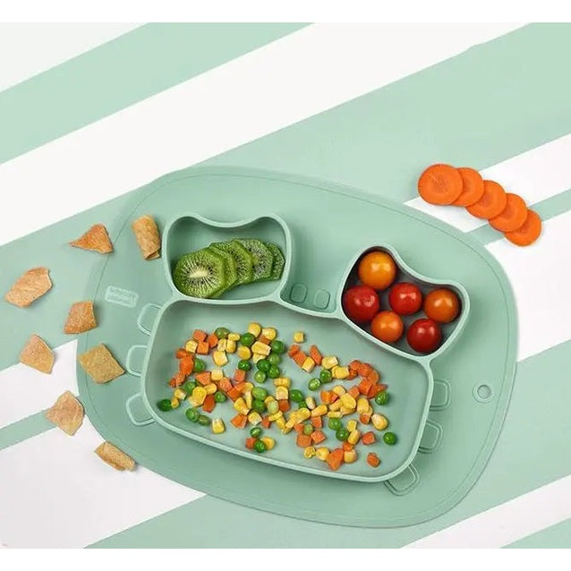 Bc Babycare Silicone Anti Slip Plate Crab in mint green with three compartments; toddler scoops colorful vegetables into each section.