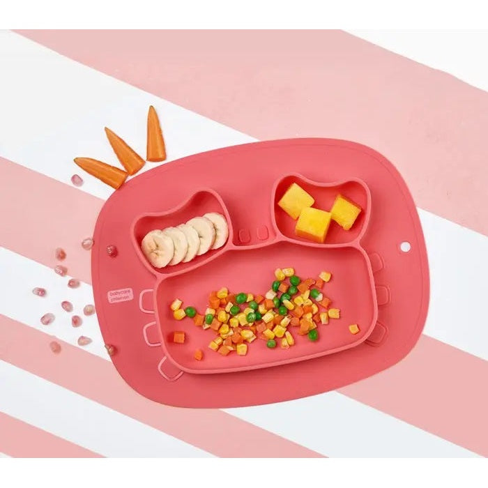BC Babycare Silicone Anti Slip Plate Crab, pink crab-shaped three-compartment plate; kid scoops diced fruit from center.