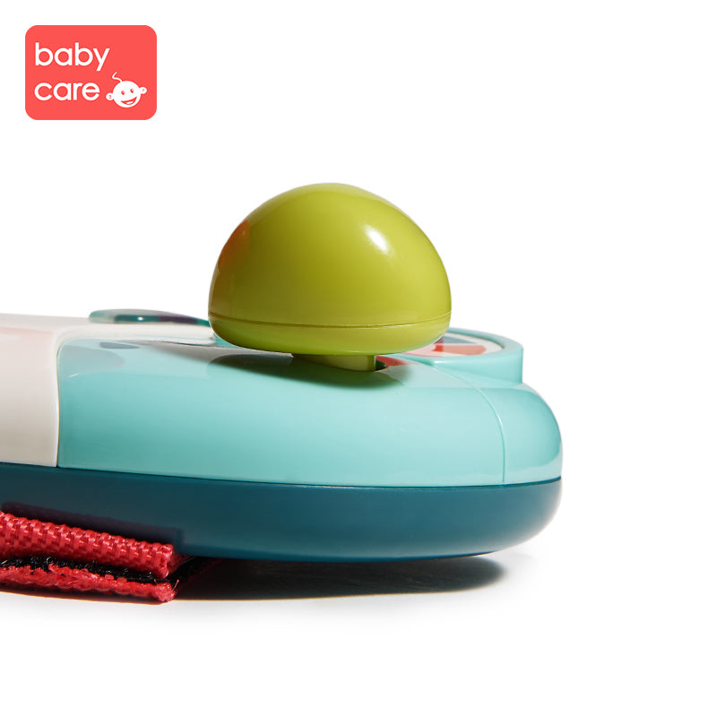 BC Babycare steering wheel toy in teal and blue with lime-green knob and red strap