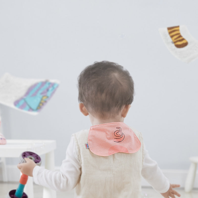 Bc Babycare Sweat Towel 3pcs set; pink bib-style towel on toddler in beige outfit