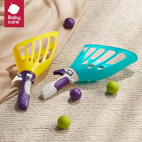BC Babycare Toss & Catch Ball Set with teal and yellow scoop nets, purple handles, and assorted balls.