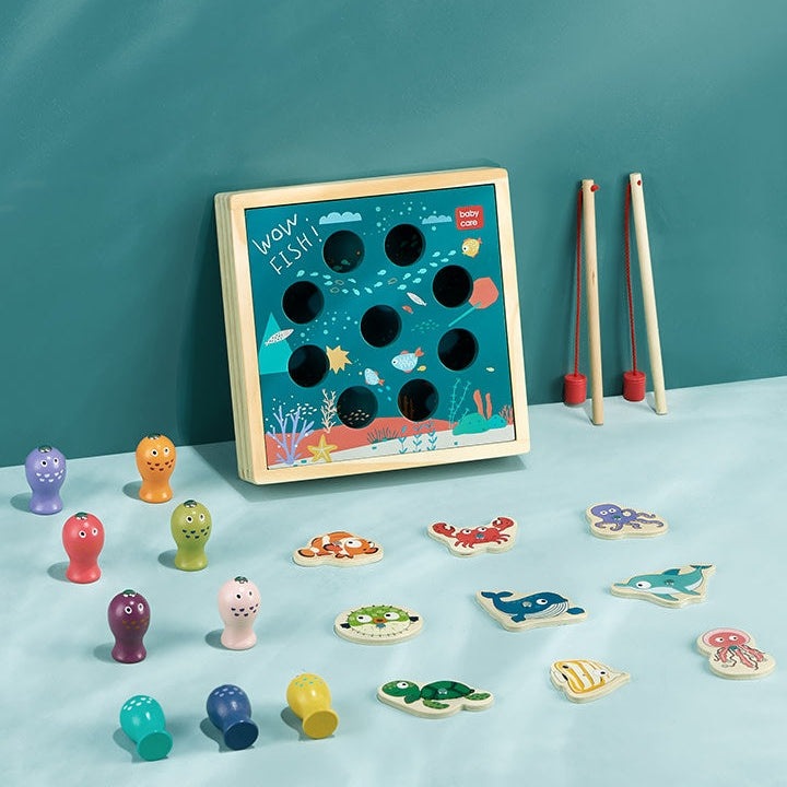 Wooden fishing game set by BC Babycare with blue 9-hole board, colorful pegs, sea creature tiles