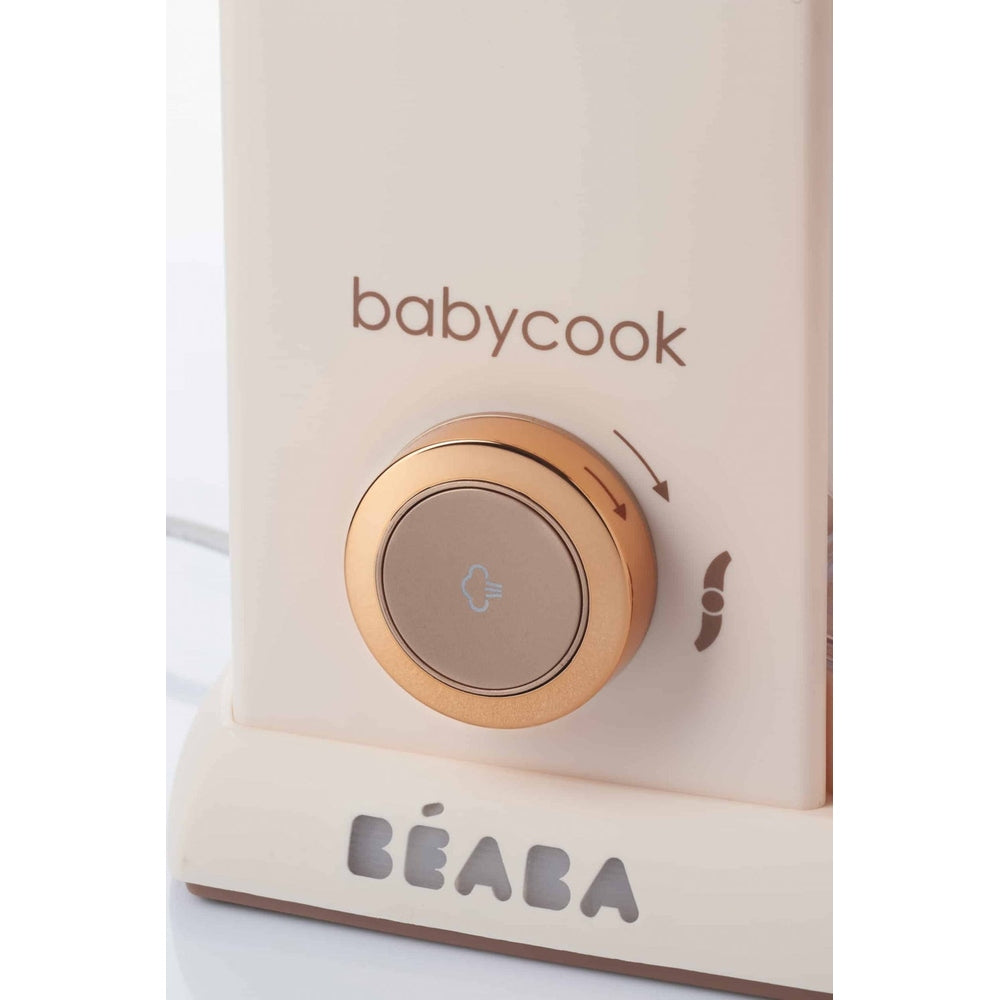 Beaba Babycook Solo baby food maker in rose gold with a round dial control