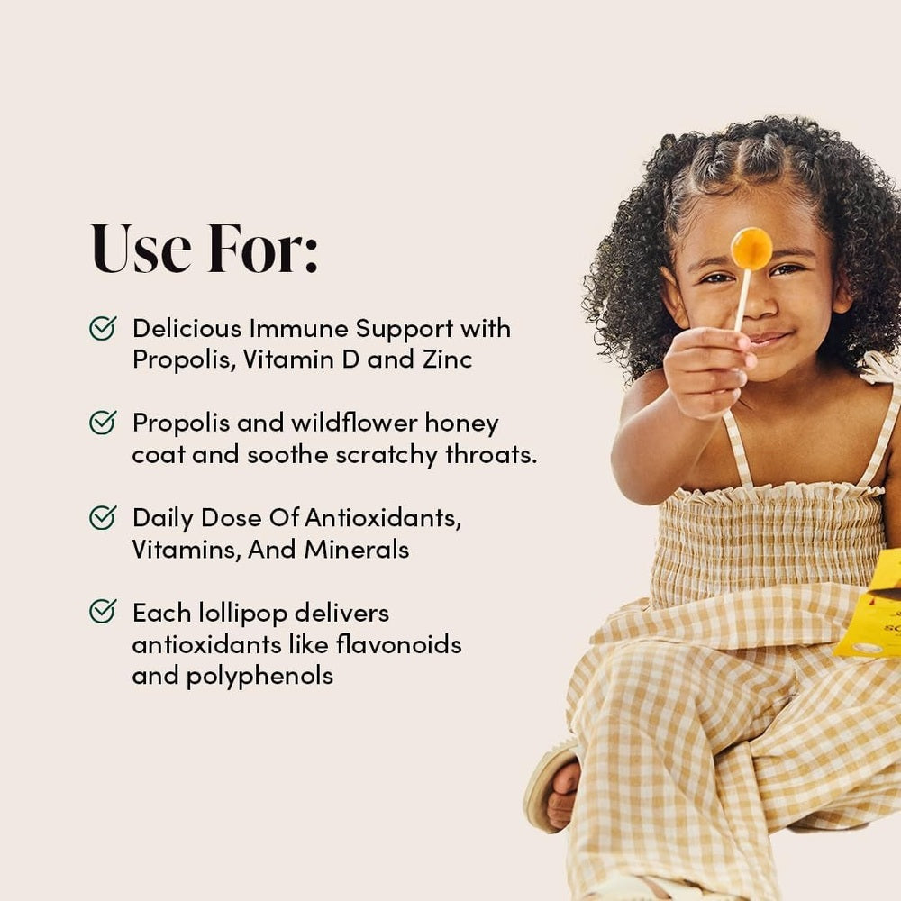 Beekeeper's Naturals Kid's Immune Support Wellness Wands Variety Pack 15 ct: smiling child holds a lollipop beside immune-boosting benefits list.