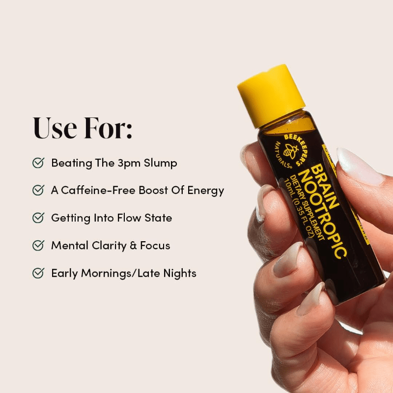 Beekeeper's Naturals B. Lxr Brain Fuel 6X10 ml bottle with yellow cap held by hand, signaling mental focus.