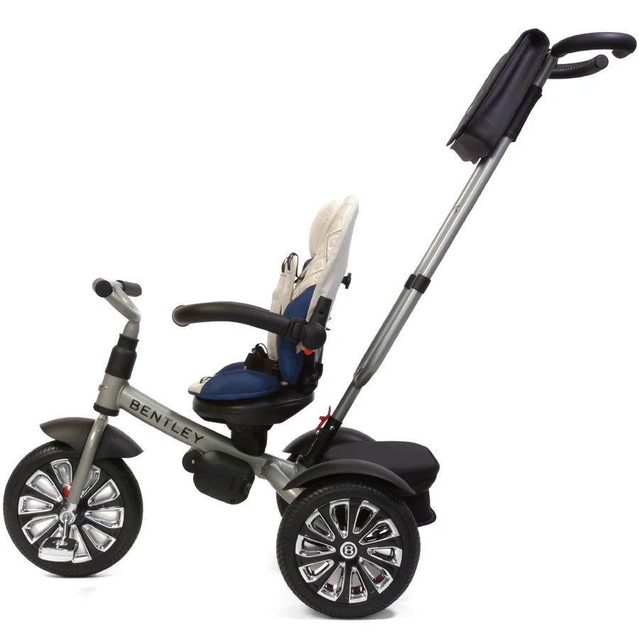 Bentley Trike 6-in-1 V2 Mulliner Cool Stone with blue seat, gray frame, and tall push handle
