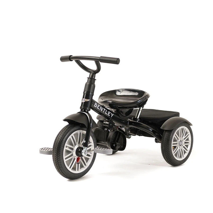 Bentley Trike 6-in-1 V2 Onyx Black: sleek black toddler tricycle with silver wheels and T-bar handle.