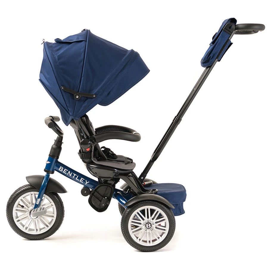 Bentley Trike 6-in-1 V2 Sequin Blue stroller-trike with blue canopy and extended push handle for parental steering.