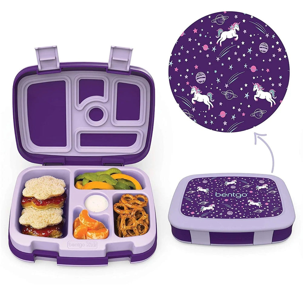 Bentogo Kids Prints Bento Lunch Box, purple 5-compartment with unicorns on starry lid, shown packed with sandwich and snacks.