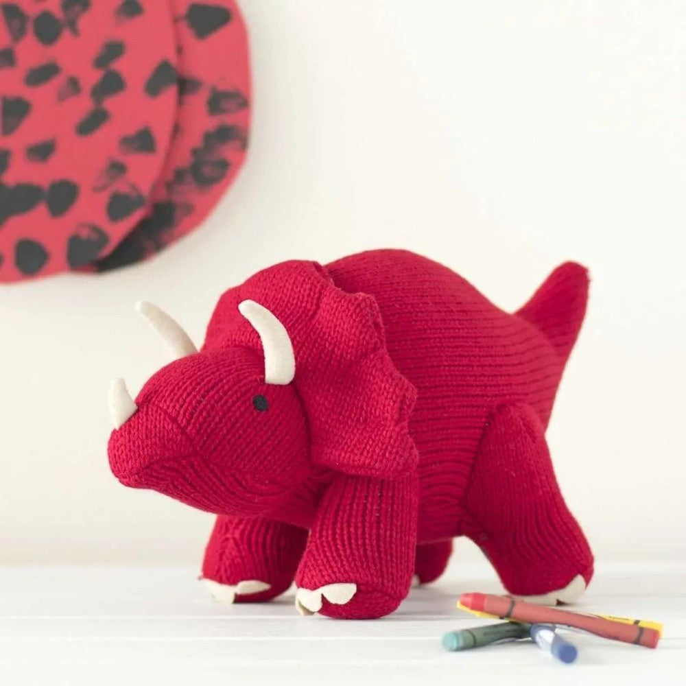 Triceratops stuffed toy by BEST YEARS; red knitted plush with white horns.