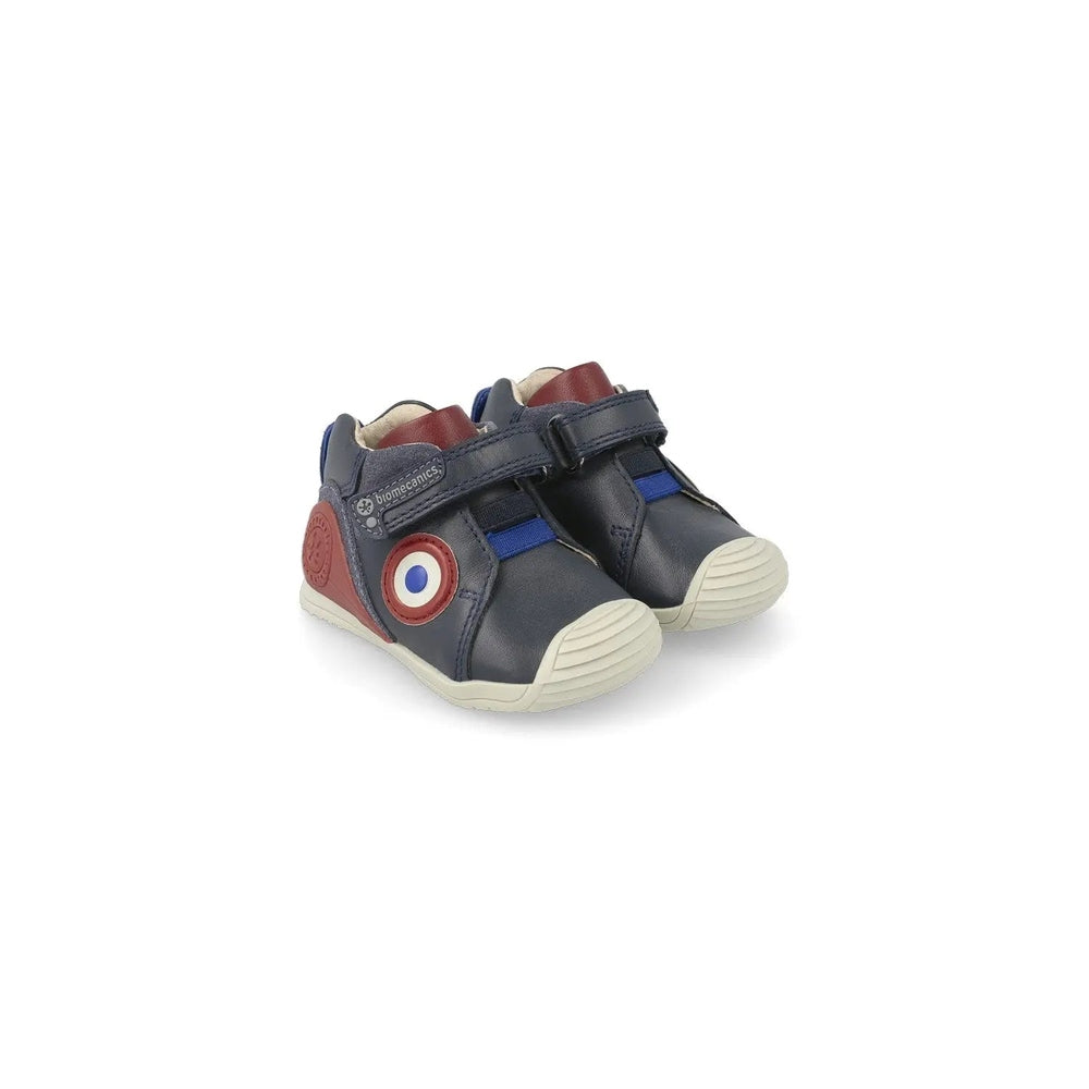 Biomecanics Azul Marino Y Botin Elasticos Casual baby boots; navy leather with elastic straps and cream sole.